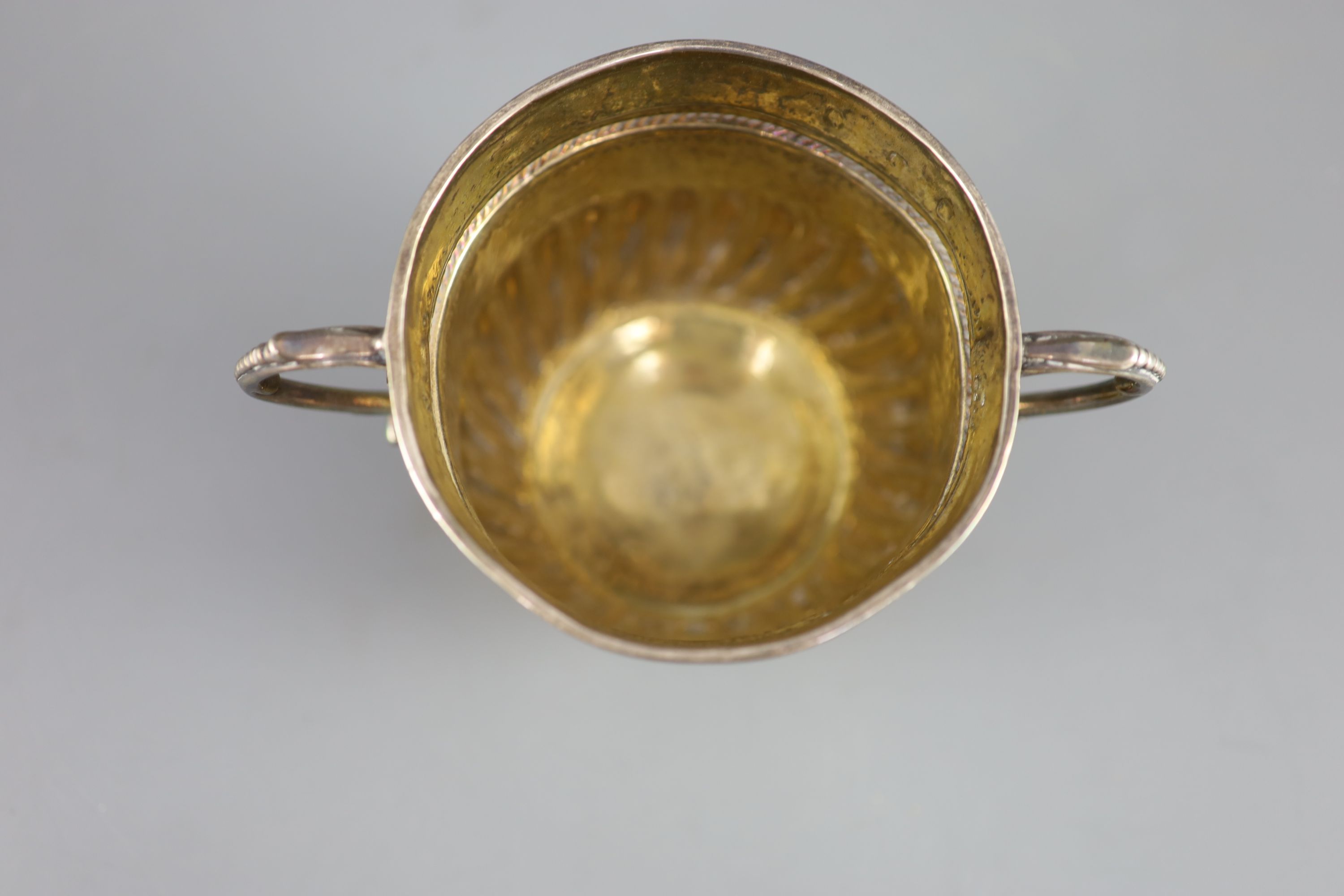 A Queen Anne demi-spiral fluted silver porringer